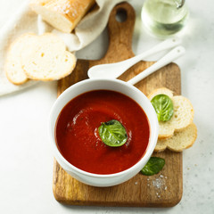 Homemade tomato soup in a white bowl