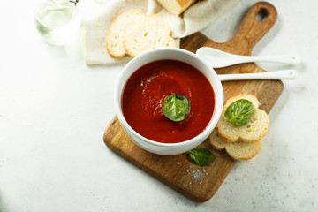 Homemade tomato soup in a white bowl