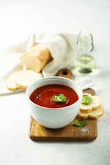 Homemade tomato soup in a white bowl