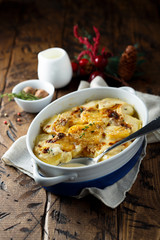 Homemade potato gratin with cream and cheese