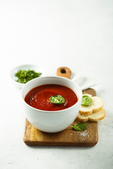 Homemade tomato soup in a white bowl