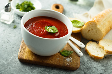 Homemade tomato soup in a white bowl
