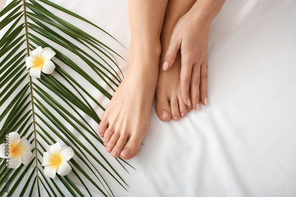 Wall mural legs of beautiful woman relaxing in spa salon