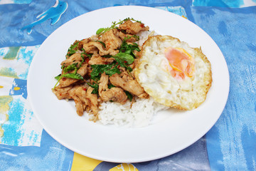 Rice with stir-fried basil leaves with chicken and sunny up on top,Thai food