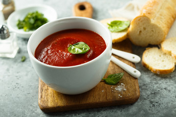Homemade tomato soup in a white bowl