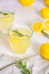 Glass of fresh lemonade on table