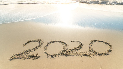 Picture of the concept of New Year's Eve 2020 welcome party on the sandy beach