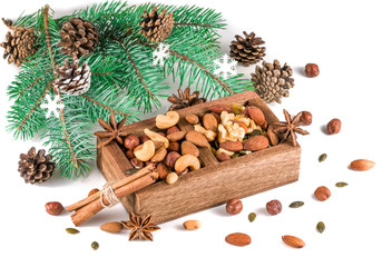 Wooden box with mixed nuts isolated on white. Christmas set.