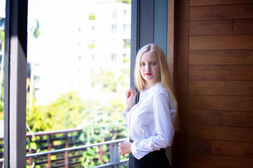 portrait of blond hair women white shirt smiling look at camera 
