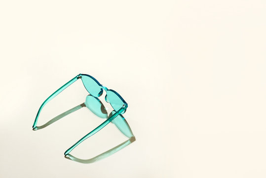 Colorful sunglasses on a table.