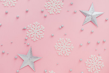 abstract christmas pink background with stars and snowflakes