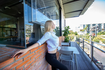 portrait of blond hair women white shirt smiling look at camera 