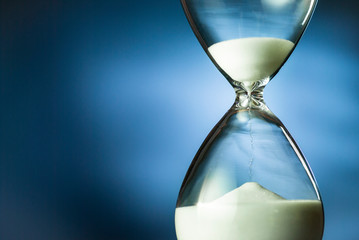 Sand running through an hourglass or egg timer
