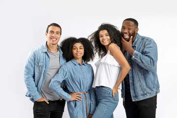 Portrait of young African-American people on white background