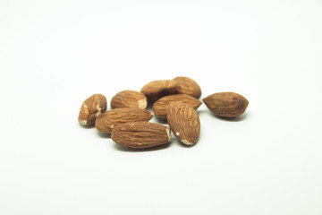 pile of almonds isolated on white background