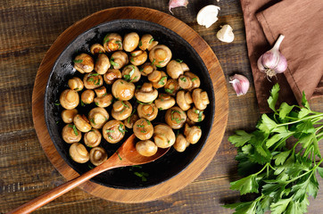 Fried mushrooms in cast iron pan