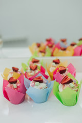 sweet cupcakes muffins with fresh strawberries and white cream