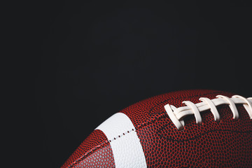 Rugby ball on dark background, closeup © Pixel-Shot