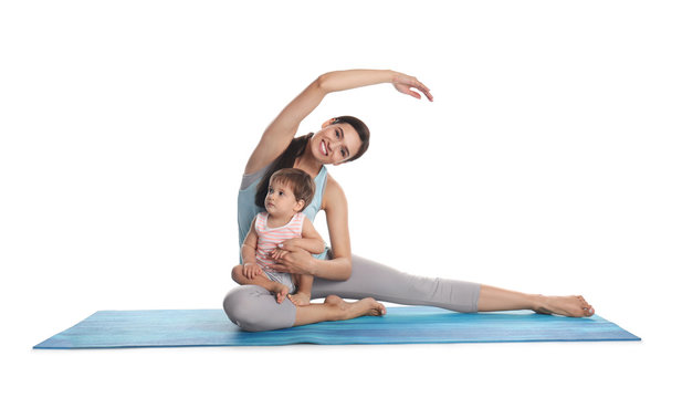 Young woman doing exercise with her son isolated on white. Time for fitness
