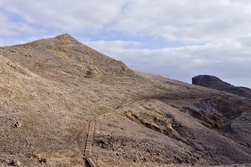 Panoramic view of a walkway in a desertic place. This is an hike path in Ponta de Sao Lourenco in Madeira Island (Madeira, Portugal, Europe)