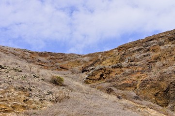 Panoramic view of an arid place with a cloudy sky. This is an hike path in Ponta de Sao Lourenco in Madeira Island (Madeira, Portugal, Europe)