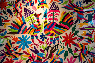 Colorful Mexican embroidery, made in brightly colored threads with original designs from the...