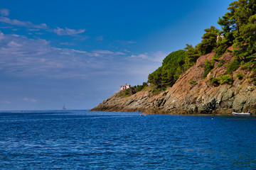 Naklejka premium The natural Gulf of Bonassola boasts a deep blue sea, a wide beach of fine gravel and several coves surrounded by a lush pine forest, also the Cinque Terre and Portofino are easily accessible both by 
