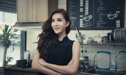 young asian woman working in coffee shop