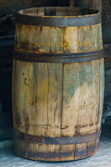 Fototapeta premium Old big wooden barrel with rusty iron circles.