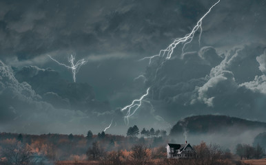 Bright lightnings. Autumn landscape. Gloomy mood. Dark sky. Home alone in field. Orange and yellow...