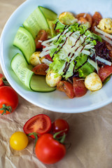 vegetable salad with lettuce, boiled tomato, cucumber and mushroom with grated cheese
