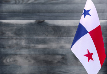 Fragment of the flag of Panama in the foreground blurred light background copy space