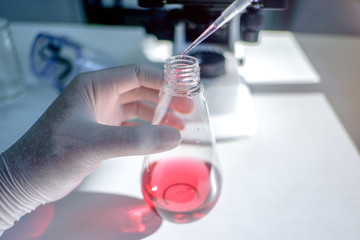 Cropped shot view of  the equipment and science experiments in Laboratory, Chemical substances for research and analyzing a sample under the microscope in laboratory.   