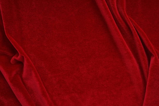 velvet texture red color background, expensive luxury fabric,  wallpaper. Christmas backdrop. copy space