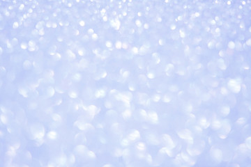 Beautiful Abstract Sparkle Glitter Lights Background. Pale Soft Delicate Sky blue. Shine Bokeh Effect. For party, holidays, celebration.