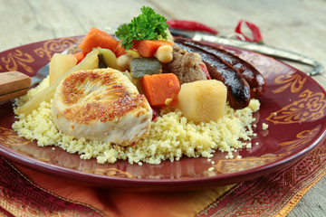 plate of royal couscous with lamb chicken and merguez