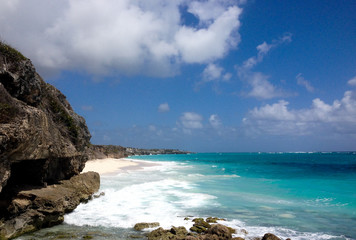 Fototapeta na wymiar Sunny day and turquoise blue sea on the island of Barbados in the Caribbean. Trail to the beach of crystal clear water..