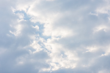 blue clouds on the sky in the rays of the sun in the fall. Landscape background texture, copy space