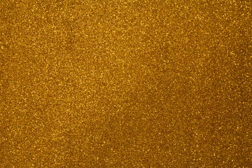 Beautiful Abstract Sparkle Glitter Lights Background. Gold Champagne. Shine Bokeh Effect. For party, holidays, celebration.