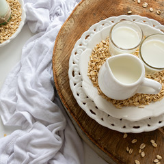 Fresh oat milk drink. Healthy nutritional ingredient, dairy themes