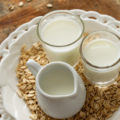 Obraz na płótnie Canvas Fresh oat milk drink. Healthy nutritional ingredient, dairy themes