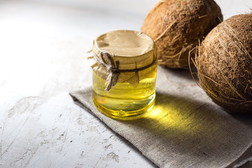 coconut and bottle of coconut palm oil. healthy food vegan aromatherapy concept