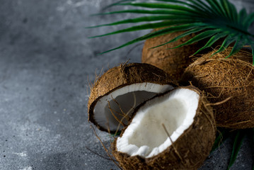  ripe chopped coconut on a gray stone background. place for your text