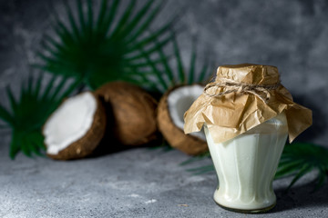 ripe chopped coconut on a gray stone background Coconut oil.
