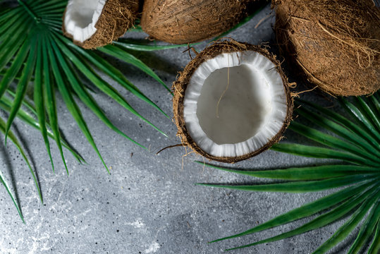  ripe chopped coconut on a gray stone background. place for your text