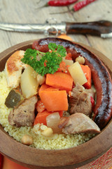 plate of royal couscous with lamb chicken and merguez