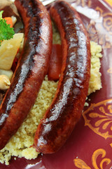 plate of royal couscous with lamb chicken and merguez