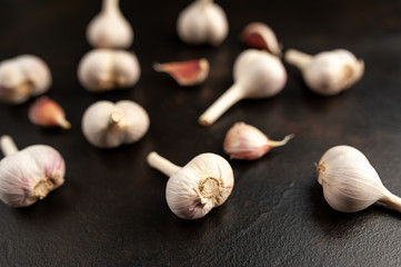 Cloves of garlic on a stone background