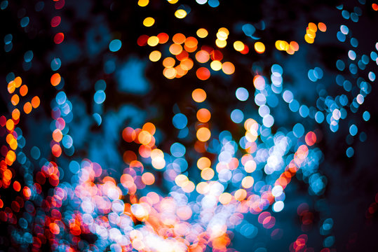 Golden bokeh mixed with blurred blue light from winter trees in Thailand. Business theoretical ideas for background use.