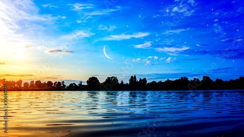 Fototapete The Romantic Moon Over Water Crescent Moon With Beautiful Sunset Background Generous Ramadan New Moon Yaalan